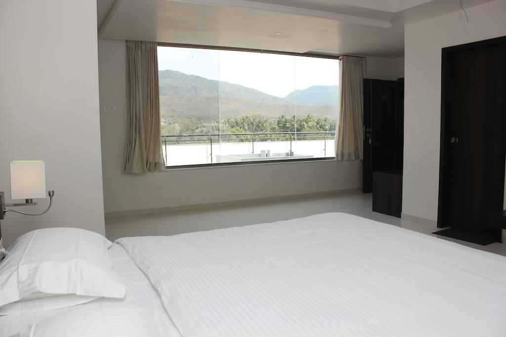 Hotel Magnum Inn Junagadh Rom bilde